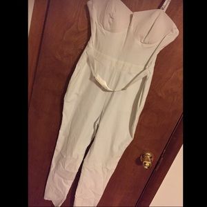 White jumper with gold waist belt